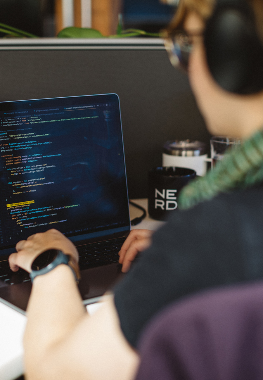 Over the shoulder shot of woman working on code