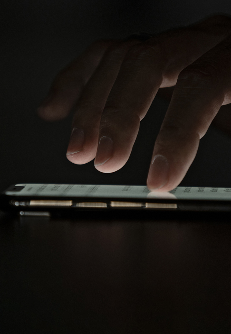 Dark background fingertips on a device