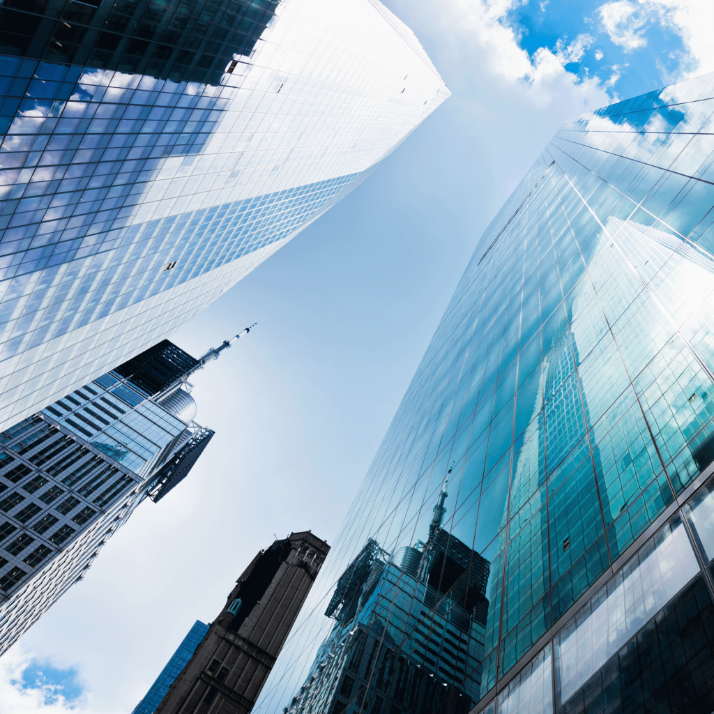 Up angled photograph of glass skyscrapers