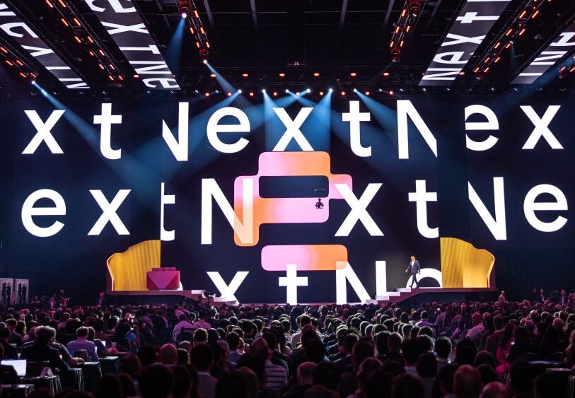 High angle shot of the Google Next 26 stage with a full audience